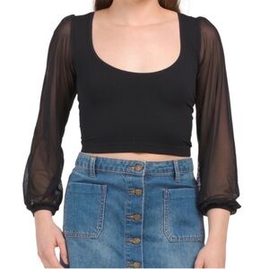 Free People’s “Lost in Love” Top with Mesh Sleeves